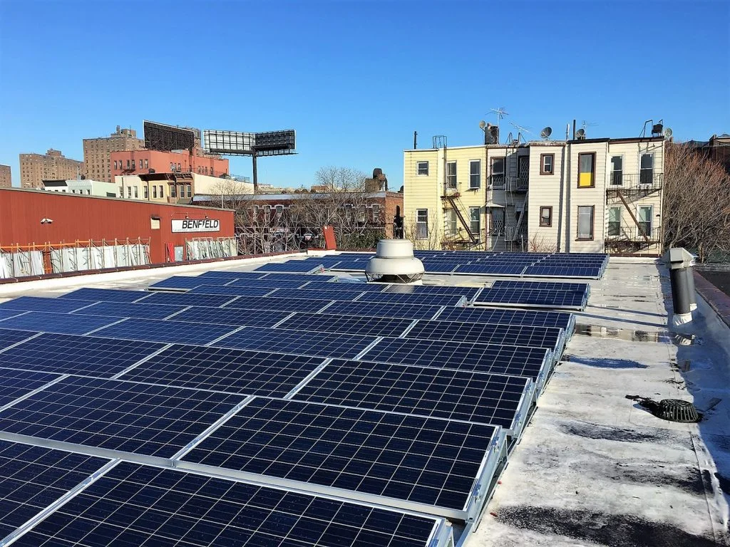 Modern residential rooftop panels following HOA solar rules Long Island